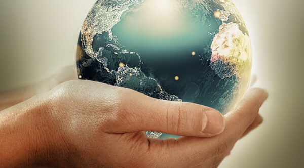 Hands holding earth - conceptual image of the earth day, saving energy, protecting the environment. Elements of this image furnished by NASA